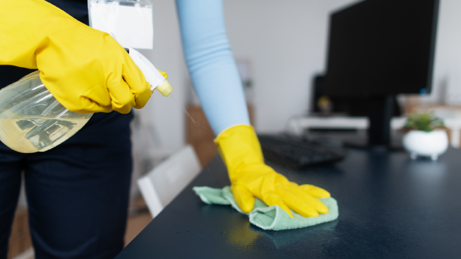 a person cleaning a desk